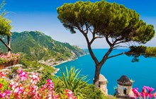 Scenic picture-postcard view of famous Amalfi Coast with Gulf of Salerno from Villa Rufolo gardens in Ravello, Campania, Italy