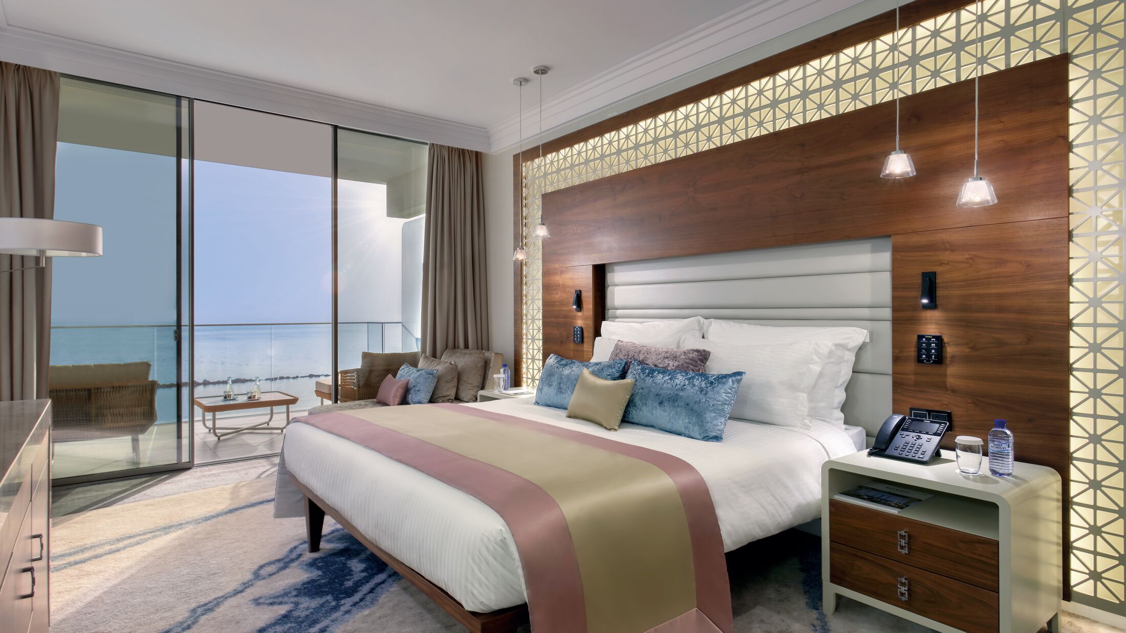 a bedroom with a large bed in a hotel room