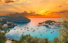 View of the famous Soller Port Marina and Dockland illuminated by sunset light in Palma de Majorca in Spain in summer season
