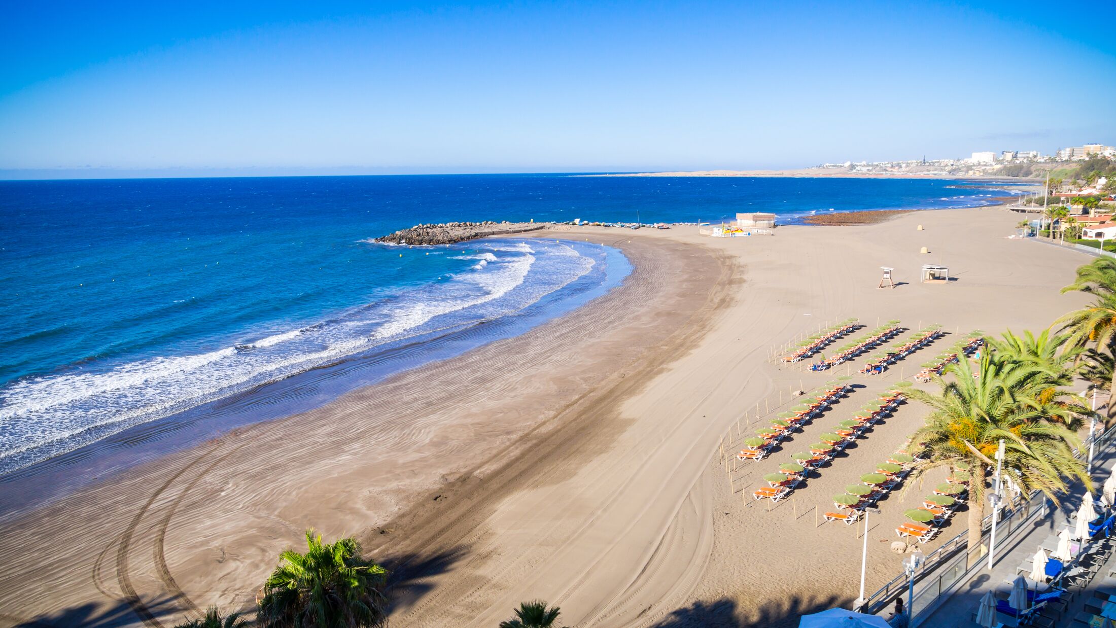 Spain Gran Canaria Sunny Beach on the Coast of San Agustin with azure Atlantic Ocean and Blue Sky